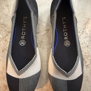 Rothy's Elegant Black and Cream Flats